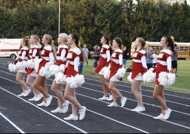 Cheerleaders+pump+up+the+crowd+at+a+Friday+night+football+game%21