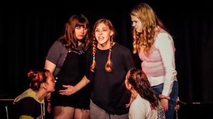 Playing the role of Jennifer Scott, Jasmine Rainey (center) is surrounded by fellow castmates in Conestoga High Schools one-act performance of No Problem. The performance is directed by Jessica Schlichtemeier with assistance from Helen Zahn.