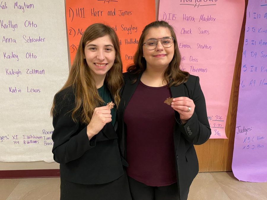 Jasmine Rainey (left) and Lily Drannen pose with their awards from the 2020 Conestoga Speech Invite. This season, most meets are being held remotely, and performers present their speeches via Zoom or through pre-recorded videos.