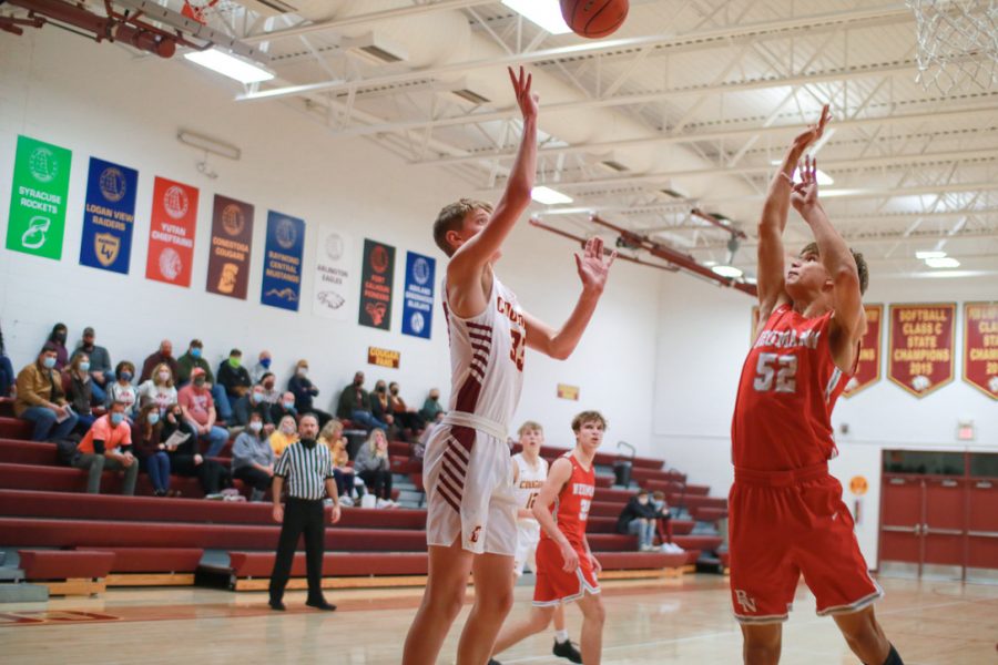 Lucas Michel drives to the rim in a contest against Bishop Neumann. The Cougars dropped the contest 71-55.