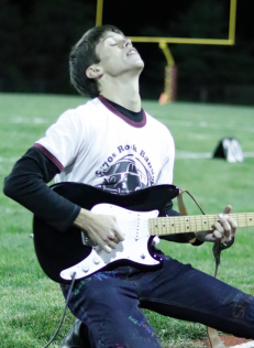 Senior Levi Bell is seen (above) rocking out at
halftime of a Conestoga football game. 