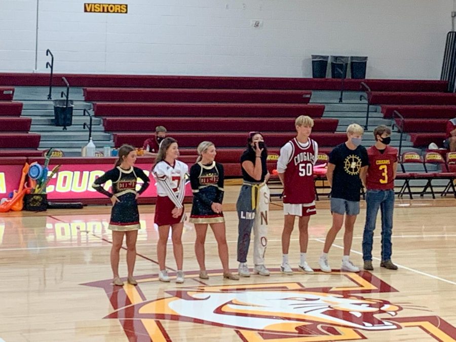 Homecoming court lines up at the pep rally.