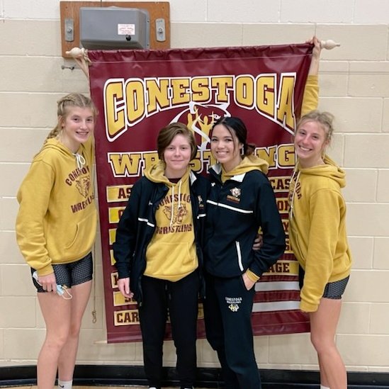 First ever Conestoga girls wrestling team pose for a photo. Throughout their season have seen great success. From left t right: Morgan H., Kylee P., Angelina F., Emory T.