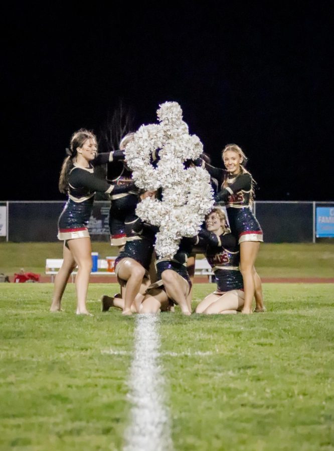 Dancers perform their halftime show at a football game