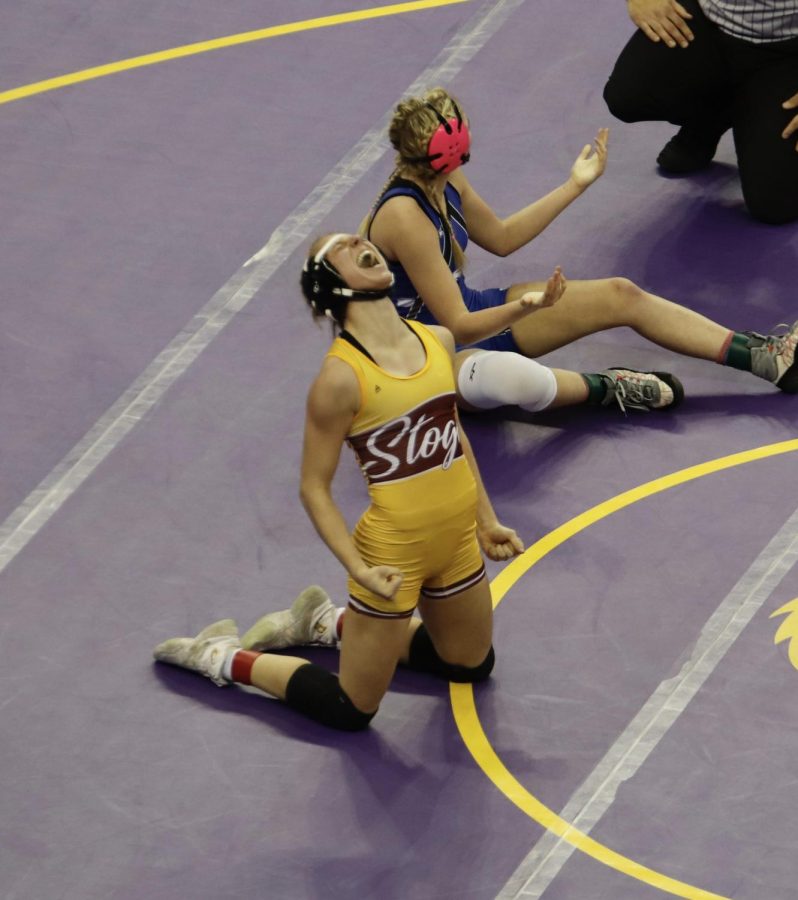 Emory T. after winning her last match and securing a medal in the state wrestling championship.